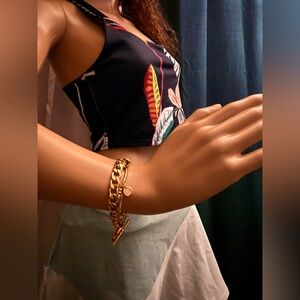 Bracelet gold-tone layered chain bracelet with a toggle clasp.